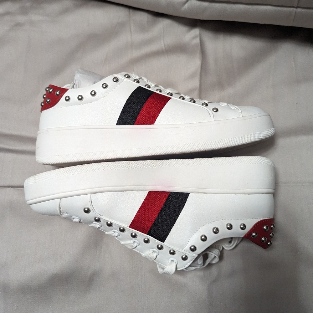 Stylish White Sneakers with Red and Black Stripes